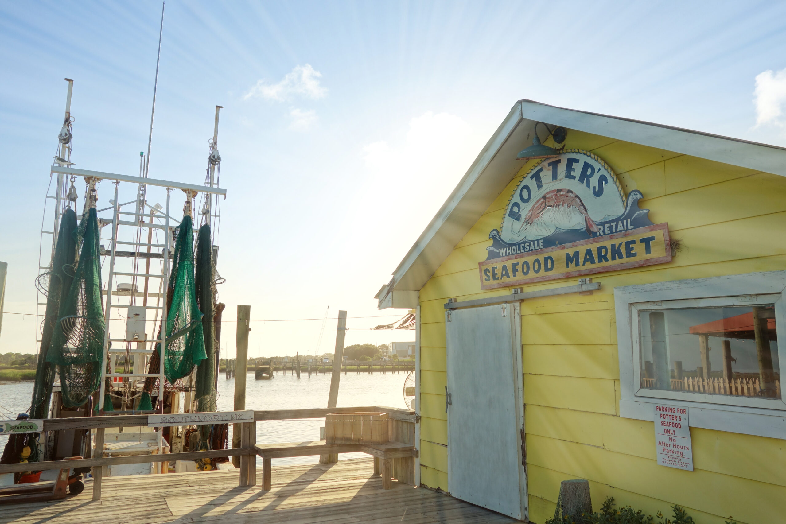 Potters Seafood Market and fishing boat on the Cape Fear River in Southport