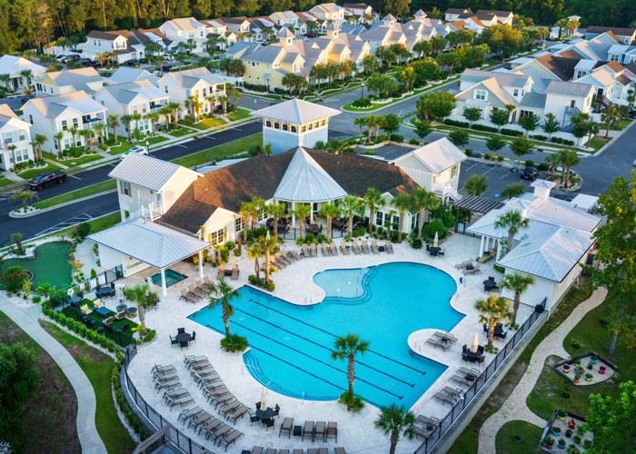 Aerial view of resort-style pool and clubhouse at Kingfish Bay community in Calabash, North Carolina